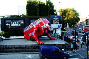 Czech sculptor David Cerny's 'London Booster,' a classic Routemaster London bus fitted with hydraulic 'press-up' arms, made to market the Czech participation in the London 2012 Olympics. Image courtesy the Czech Embassy, London. 